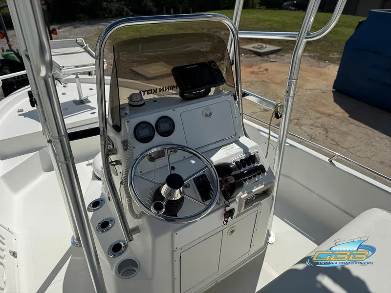 Slide: The Image of 2004 NauticStar 1900 Nautic Bay boat console with steering wheel and controls. - 9