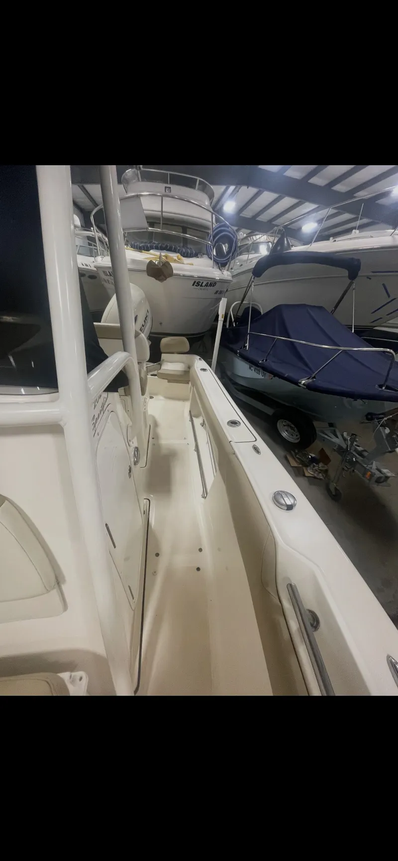 Slide: The Image of Interior view of a 2019 Pioneer 202 Sportfish boat in storage. - 7