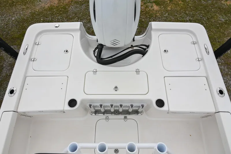 Slide: The Image of 2021 Sea Pro 208 Bay boat deck with storage compartments and motor. - 11