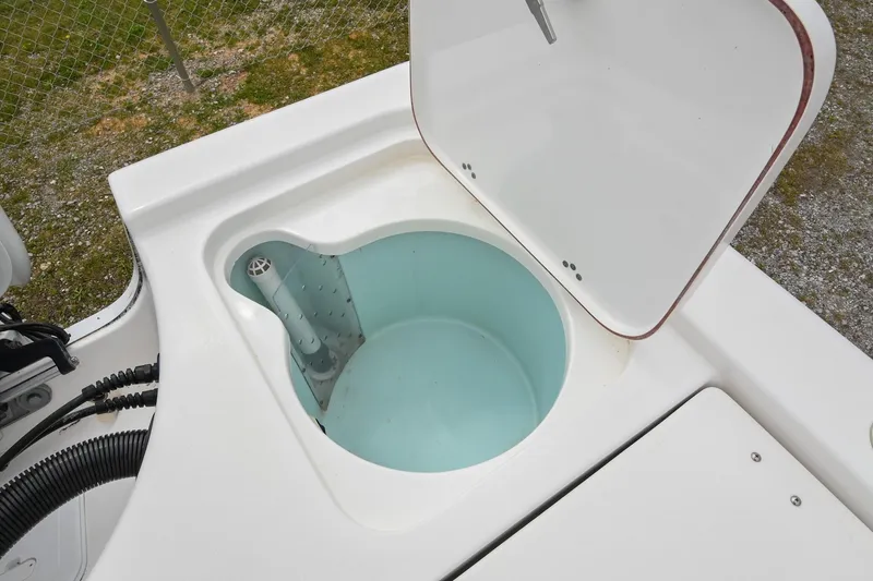 Slide: The Image of Open livewell on 2021 Sea Pro 208 Bay boat, showcasing interior design. - 13
