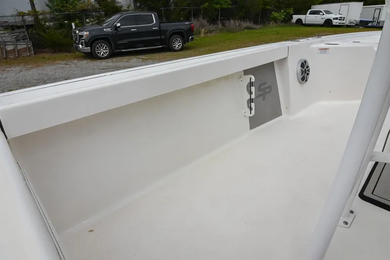 Slide: The Image of 2021 Sea Pro 208 Bay boat interior with clean white deck and side panel. - 19