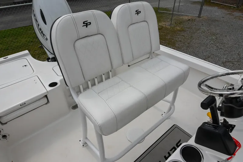 Slide: The Image of 2021 Sea Pro 208 Bay boat with white dual seats and steering console. - 27