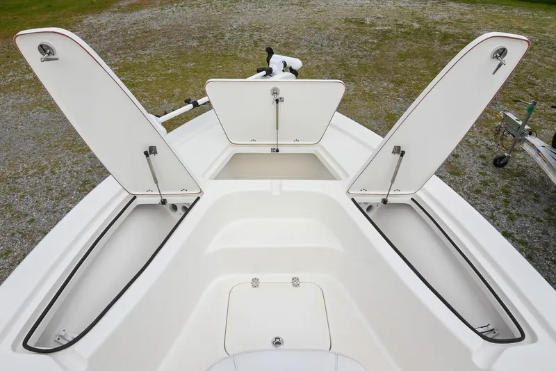 Slide: The Image of 2021 Sea Pro 208 Bay boat with open storage compartments on deck. - 31