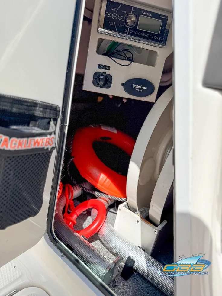 Slide: The Image of 2015 Sea Ray 240 Sundeck interior with safety equipment and control panel. - 37