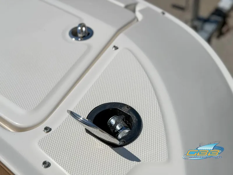 Slide: The Image of Close-up of 2015 Sea Ray 240 Sundeck boat deck with metal fitting. - 38