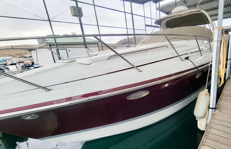 Slide: The Image of 2007 Formula 34 Cruiser docked in a marina, showcasing sleek design and elegant lines. - 10