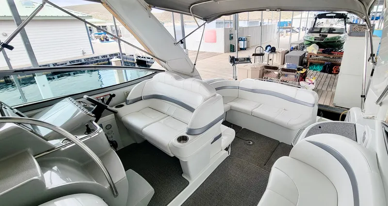 Slide: The Image of 2007 Formula 34 Cruiser interior with white seating and modern helm. - 13