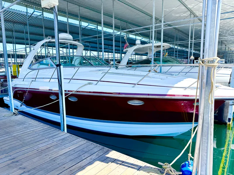 Slide: The Image of 2007 Formula 34 Cruiser docked in a marina under a covered structure. - 9
