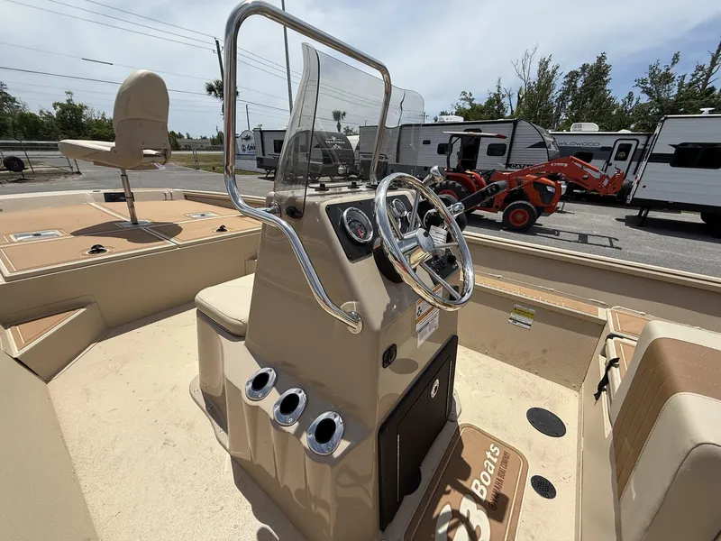 Slide: The Image of 2025 G3 Bay 20 Seadeck boat interior with steering console and seating. - 4