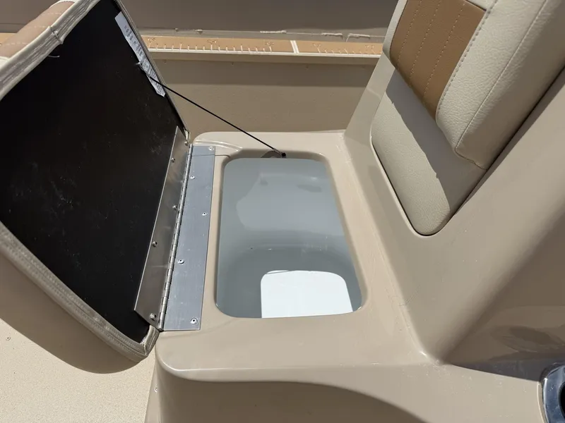 Slide: The Image of Open storage compartment on 2025 G3 Bay 20 Seadeck boat seat. - 6