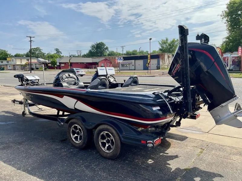Slide: The Image of 2015 Nitro Z9 DC Z-PRO boat on trailer, parked outdoors, featuring sleek design and powerful engine. - 12