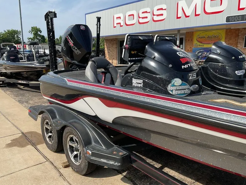 Slide: The Image of 2015 Nitro Z9 DC Z-PRO boat on trailer at dealership, featuring dual engines and sleek design. - 13