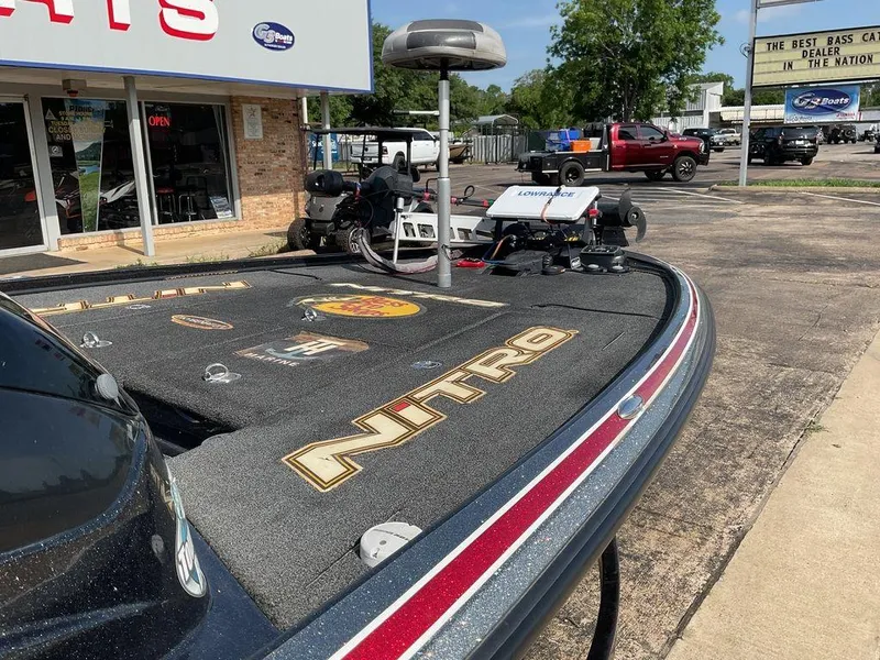 Slide: The Image of 2015 Nitro Z9 DC Z-PRO boat parked outside a dealership on a sunny day. - 14