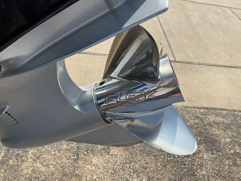 Slide: The Image of Close-up of a 2015 Nitro Z9 DC Z-PRO boat propeller on concrete surface. - 9