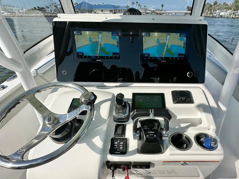 Slide: The Image of 2020 Sportsman Open 282 Center Console helm with dual navigation screens and controls. - 12