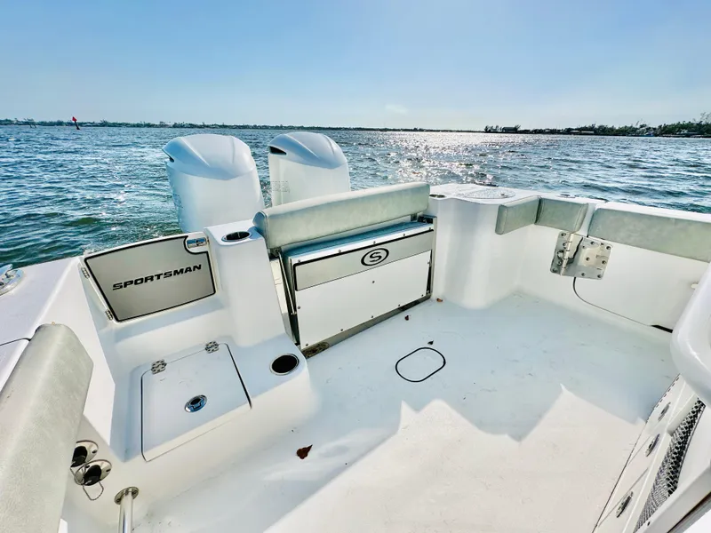 Slide: The Image of 2020 Sportsman Open 282 Center Console boat, spacious deck, dual engines, ocean view. - 23