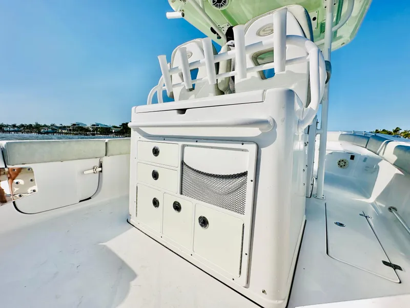 Slide: The Image of 2020 Sportsman Open 282 Center Console boat interior with seating and storage compartments. - 24
