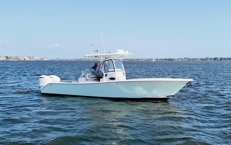Slide: The Image of 2020 Sportsman Open 282 Center Console boat on calm water. - 3