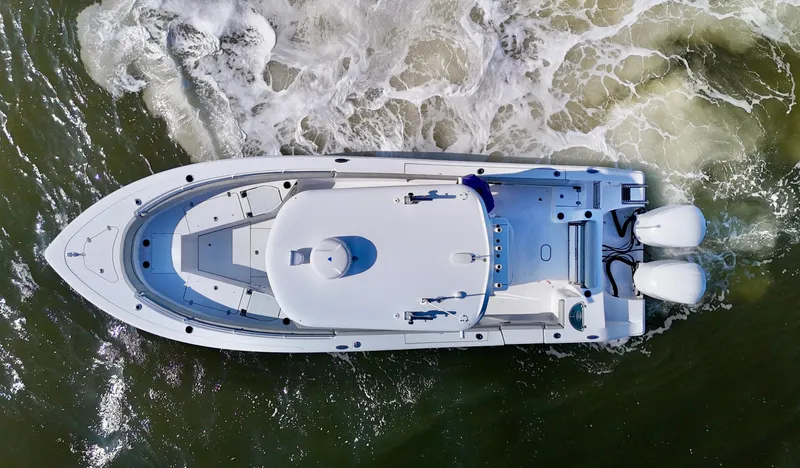 Slide: The Image of Aerial view of 2020 Sportsman Open 282 Center Console boat navigating through water. - 5