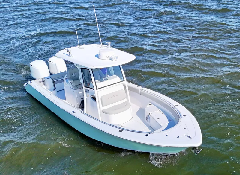 Slide: The Image of 2020 Sportsman Open 282 Center Console boat on open water. - 8