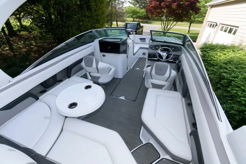 Slide: The Image of 2022 Four Winns HD5 OB boat interior with sleek seating and modern design. - 5