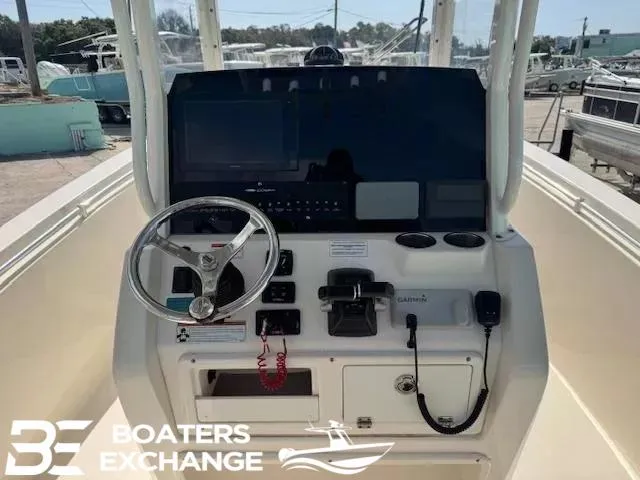 Slide: The Image of 2020 Cobia 262 boat dashboard with steering wheel and navigation controls at Boaters Exchange. - 7