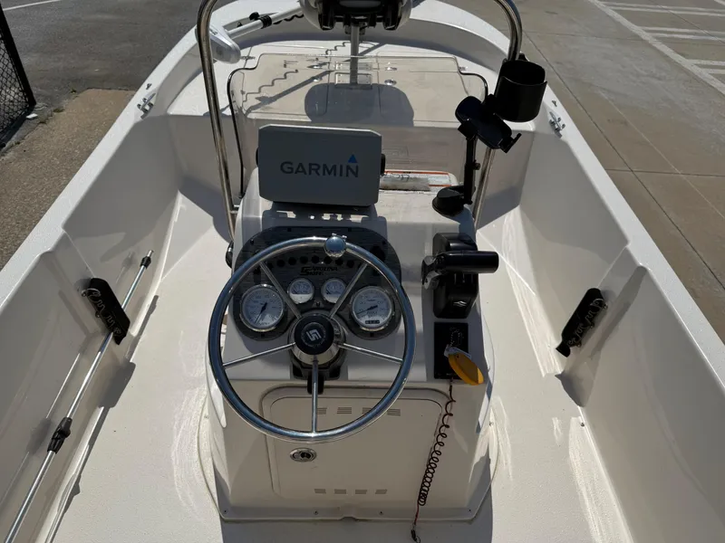 Slide: The Image of 2021 Carolina Skiff 192 JLS boat console with Garmin navigation system and steering wheel. - 18