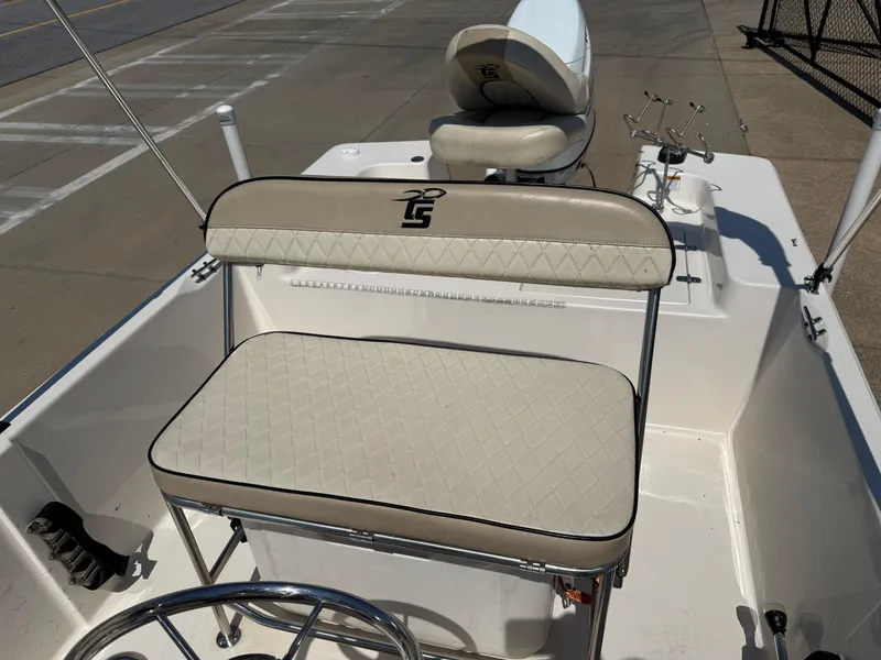 Slide: The Image of 2021 Carolina Skiff 192 JLS boat interior with cushioned seating and steering wheel. - 22