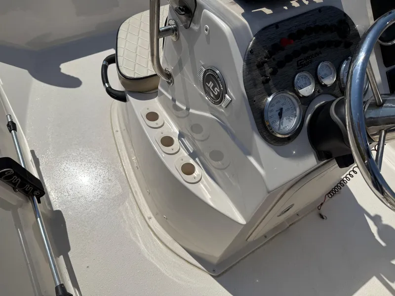 Slide: The Image of 2021 Carolina Skiff 192 JLS boat console with steering wheel and gauges. - 23