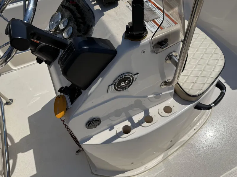 Slide: The Image of Center console of a 2021 Carolina Skiff 192 JLS boat with controls and gauges. - 25