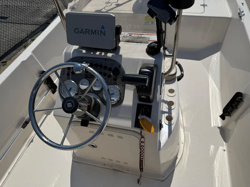 Slide: The Image of 2021 Carolina Skiff 192 JLS boat console with Garmin navigation system and steering wheel. - 26