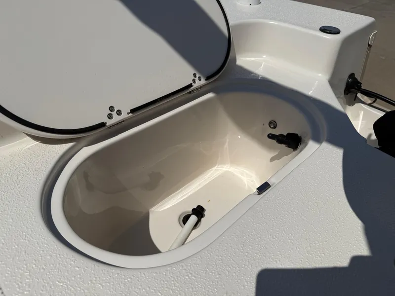 Slide: The Image of Open storage compartment on 2021 Carolina Skiff 192 JLS boat. - 29
