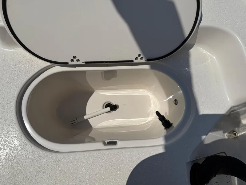 Slide: The Image of Open storage compartment on 2021 Carolina Skiff 192 JLS boat. - 30