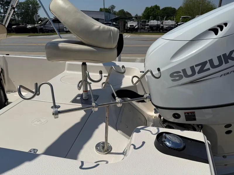 Slide: The Image of 2021 Carolina Skiff 192 JLS boat with Suzuki engine and fishing rod holders. - 31