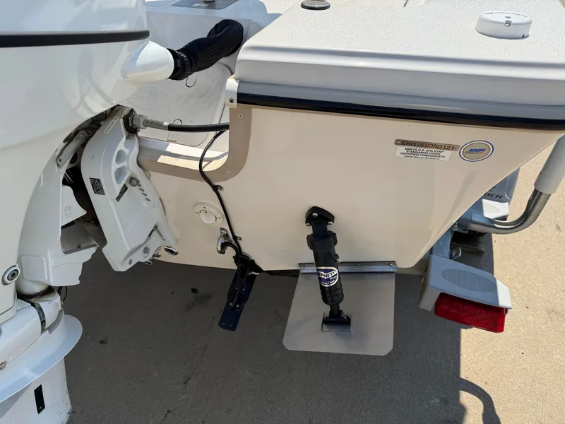 Slide: The Image of 2021 Carolina Skiff 192 JLS boat stern with motor and trim tab details. - 33