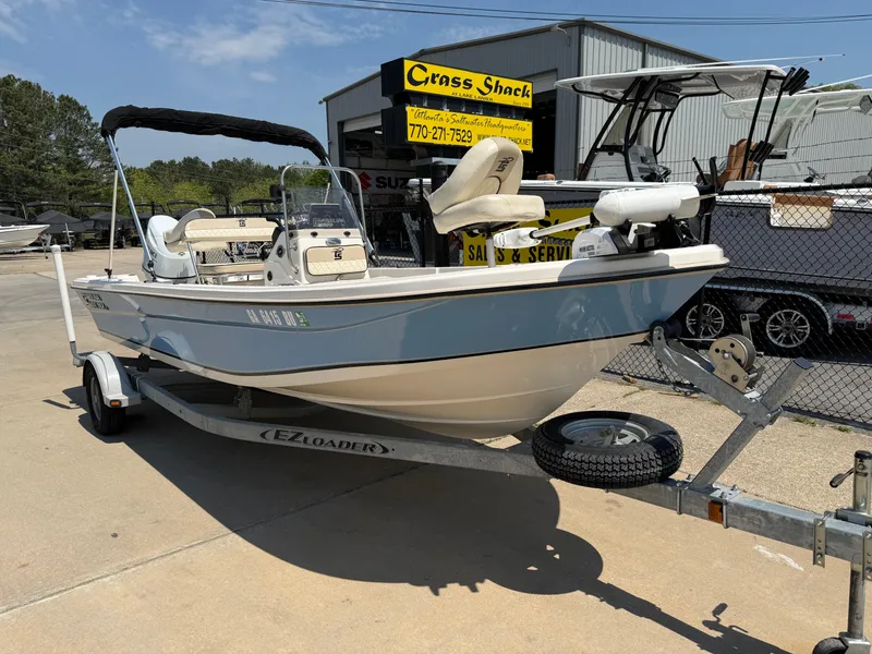 Slide: The Image of 2021 Carolina Skiff 192 JLS boat on trailer at dealership, featuring a sleek design. - 35