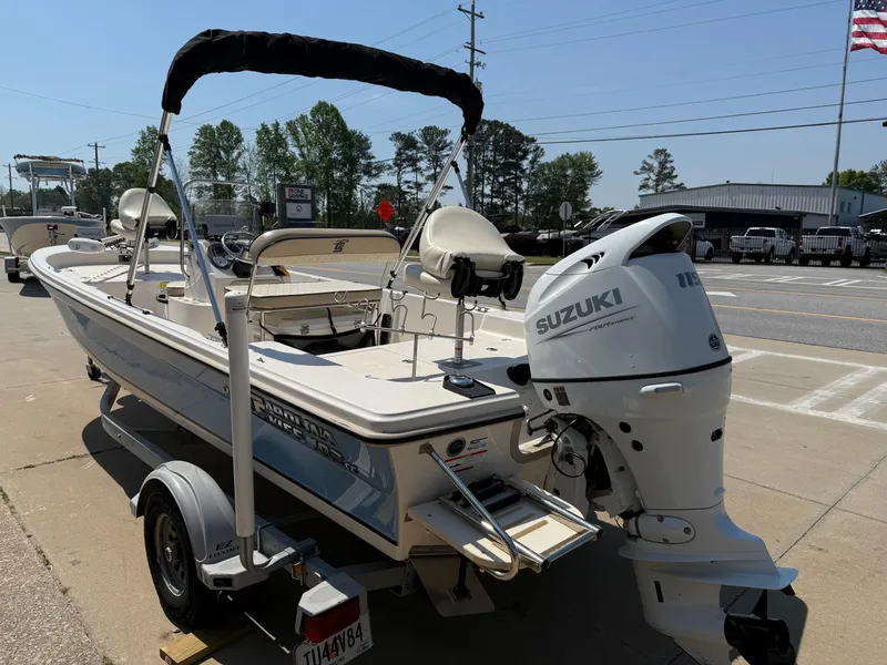 Slide: The Image of 2021 Carolina Skiff 192 JLS boat with Suzuki outboard motor on a trailer. - 5
