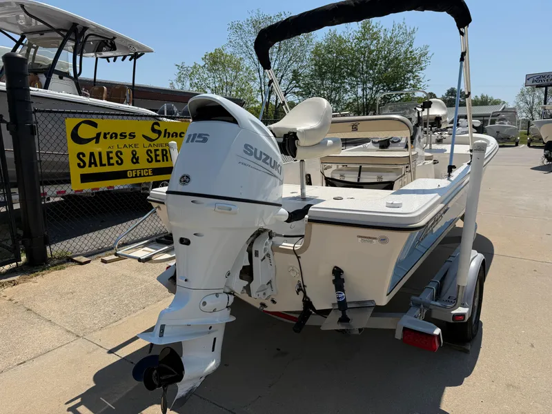 Slide: The Image of 2021 Carolina Skiff 192 JLS boat with Suzuki outboard motor at sales lot. - 7