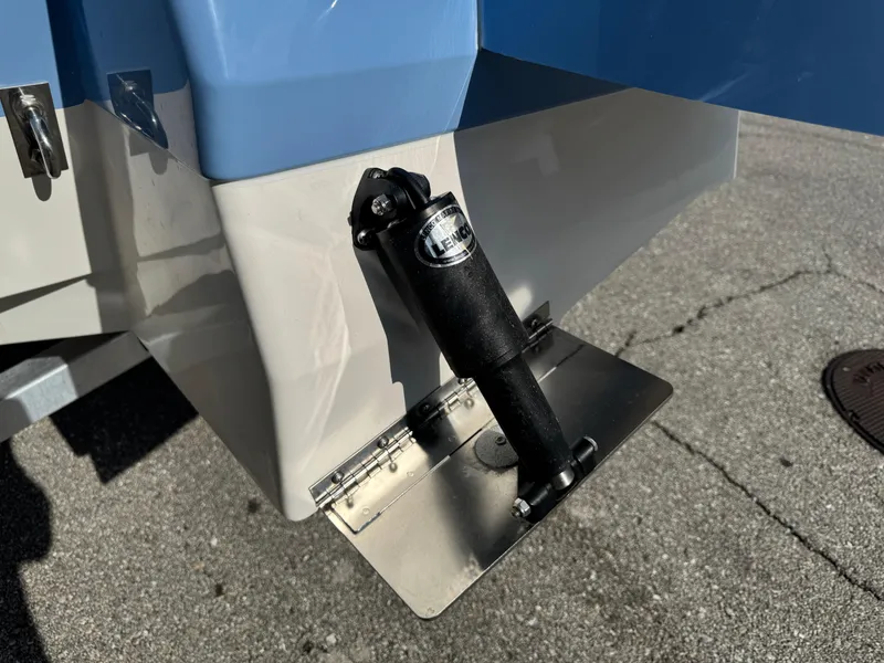Slide: The Image of Trim tab on 2023 Robalo 246 Cayman boat, close-up view. - 10