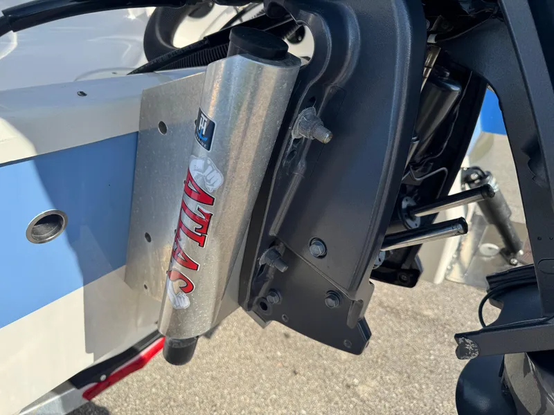 Slide: The Image of 2023 Robalo 246 Cayman boat with Atlas hydraulic jack plate detail. - 12