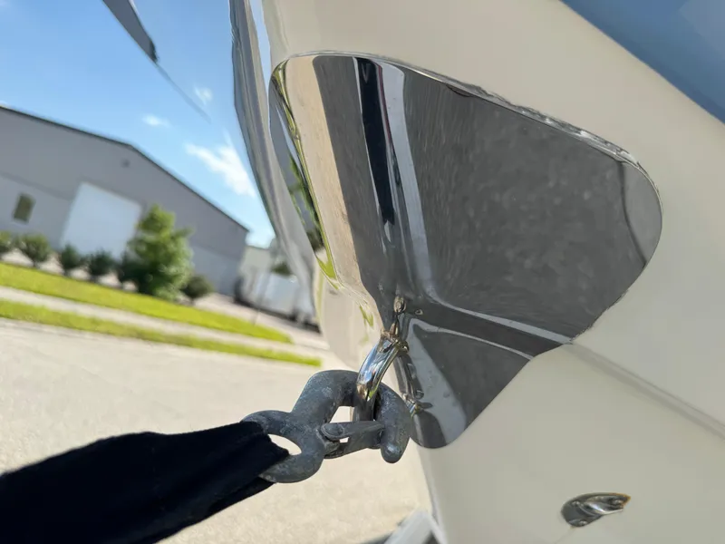 Slide: The Image of 2023 Robalo 246 Cayman boat bow with metal cleat and rope attachment. - 23