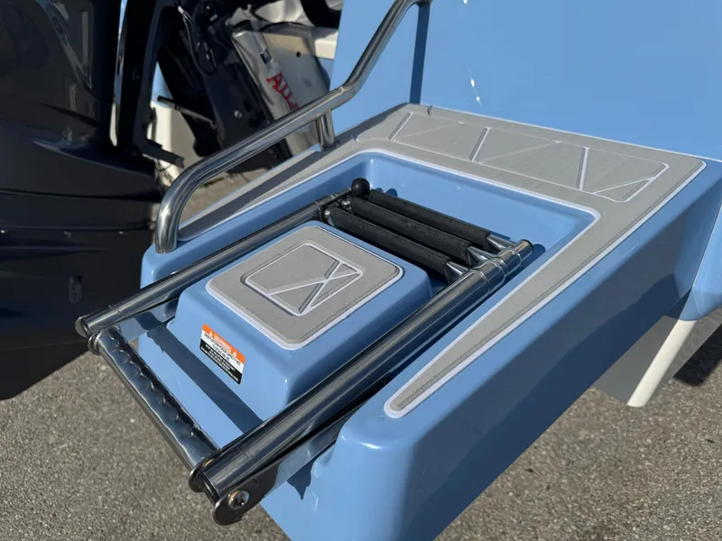 Slide: The Image of 2023 Robalo 246 Cayman boat ladder and platform detail in blue. - 6