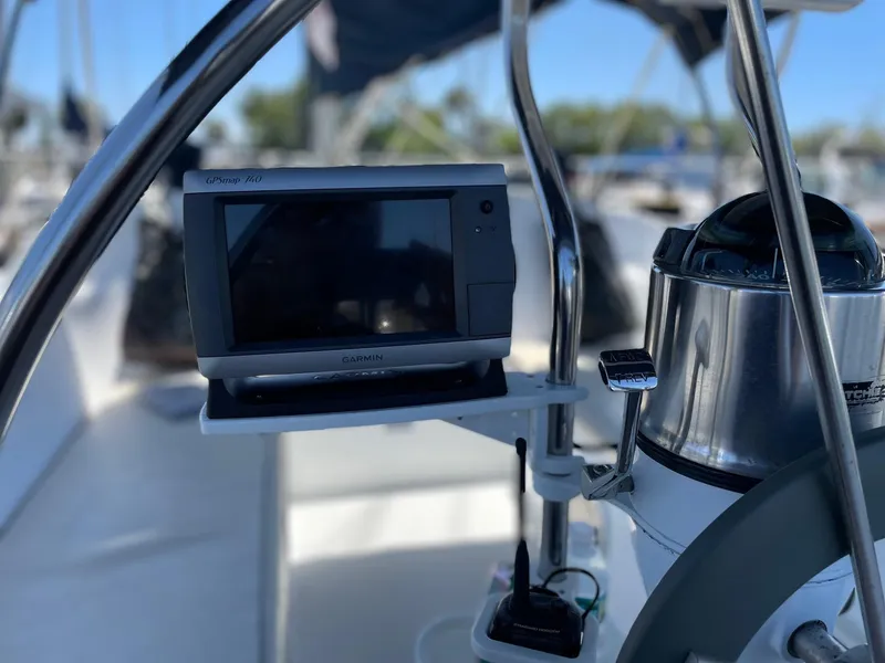 Slide: The Image of Cockpit of 1997 Catalina 320 sailboat with navigation equipment and steering wheel. - 17