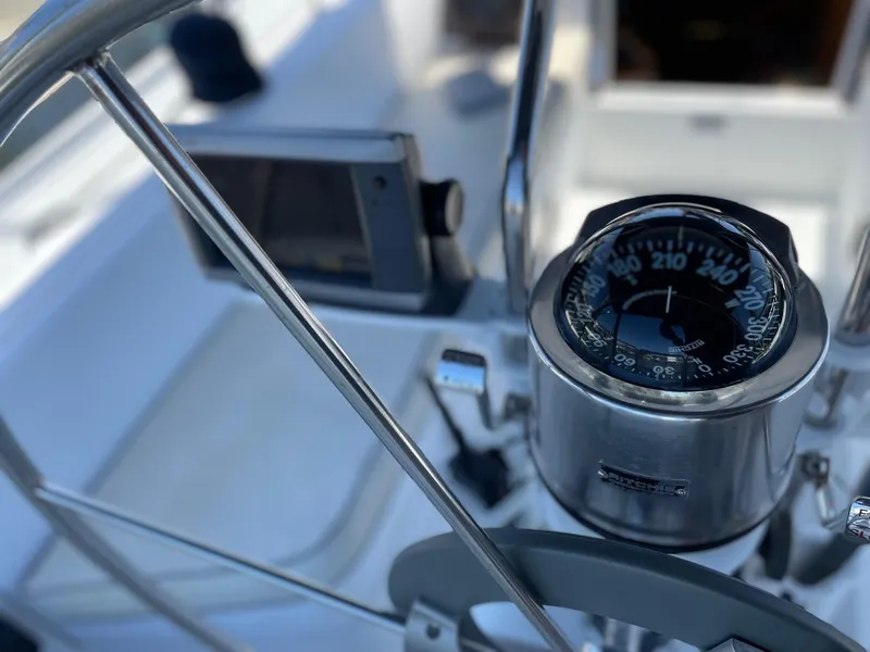 Slide: The Image of Cockpit of 1997 Catalina 320 sailboat with compass and navigation equipment. - 19