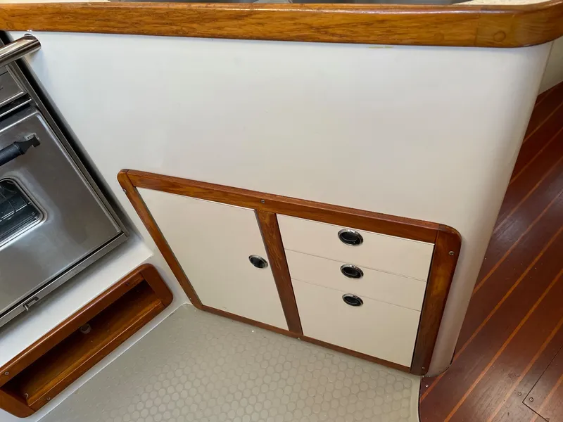 Slide: The Image of Cabinet and drawers in 1997 Catalina 320 yacht interior with wood trim. - 39