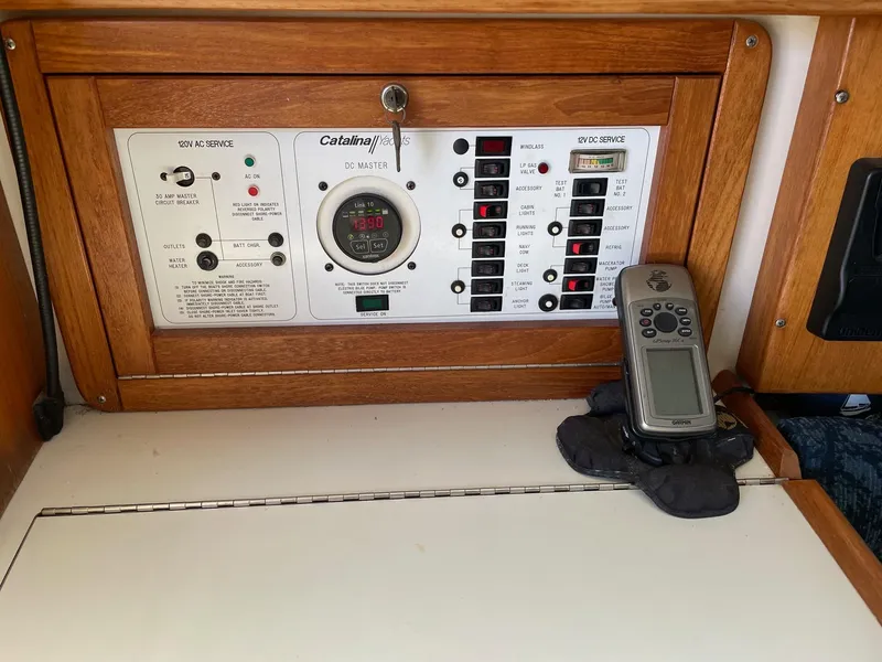Slide: The Image of Control panel of a 1997 Catalina 320 sailboat with navigation equipment. - 9