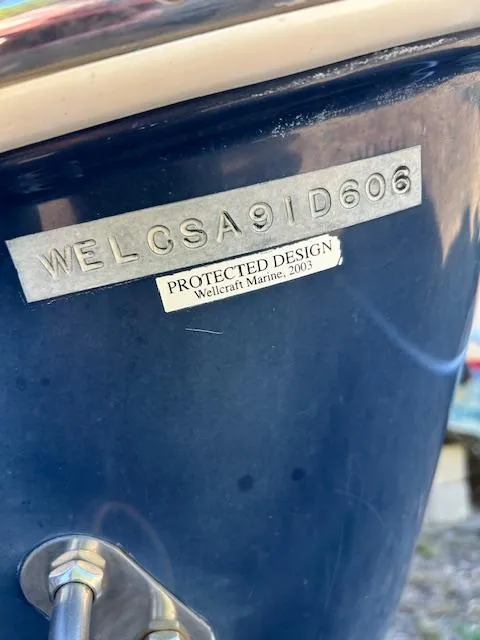 Slide: The Image of 2006 Wellcraft 252 Coastal boat hull identification number and protected design label. - 6