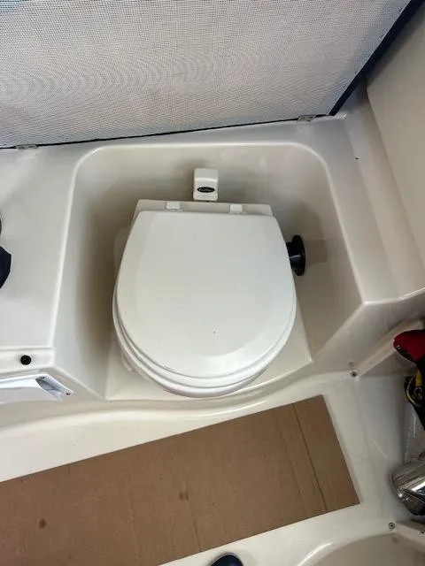 Slide: The Image of 2006 Wellcraft 252 Coastal boat toilet in compact cabin space. - 9