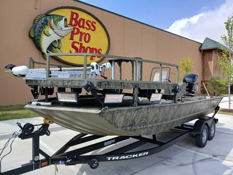 Slide: The Image of 2025 Tracker Grizzly 2072 CC Sportsman boat at Bass Pro Shops, on a trailer. - 6