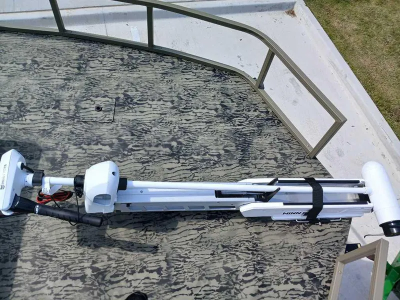 Slide: The Image of 2025 Tracker Grizzly 2072 CC Sportsman boat deck with mounted trolling motor. - 7